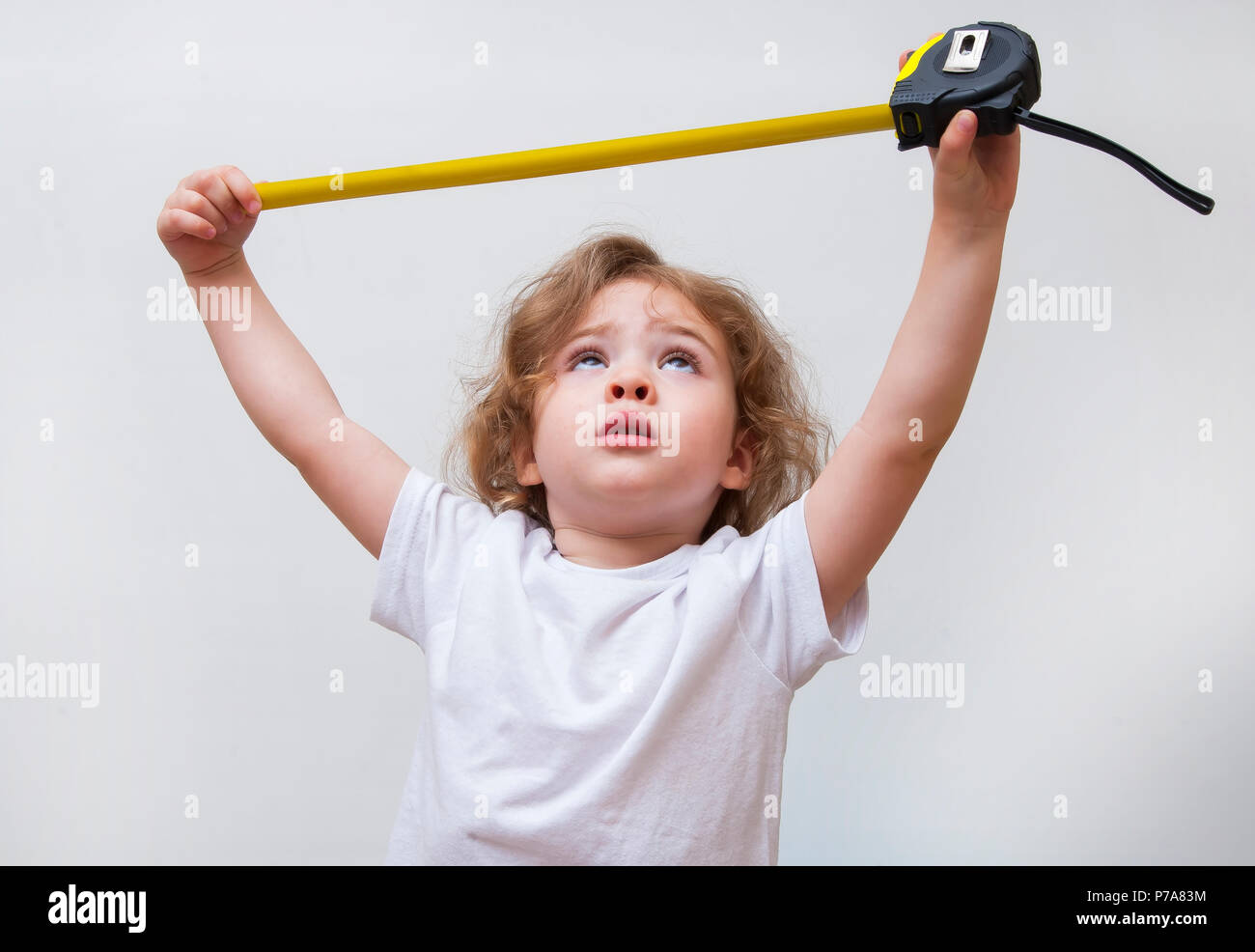little girl with measuring tape Stock Photo Alamy