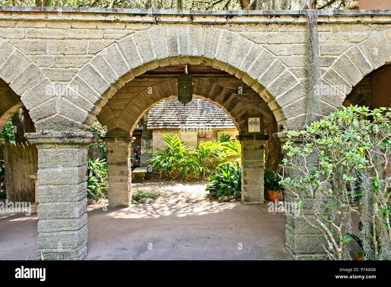 An archway where you enter the gardens at the Historic Gonzalez Alvarez House in St. Augustine, Florida USA Stock Photo