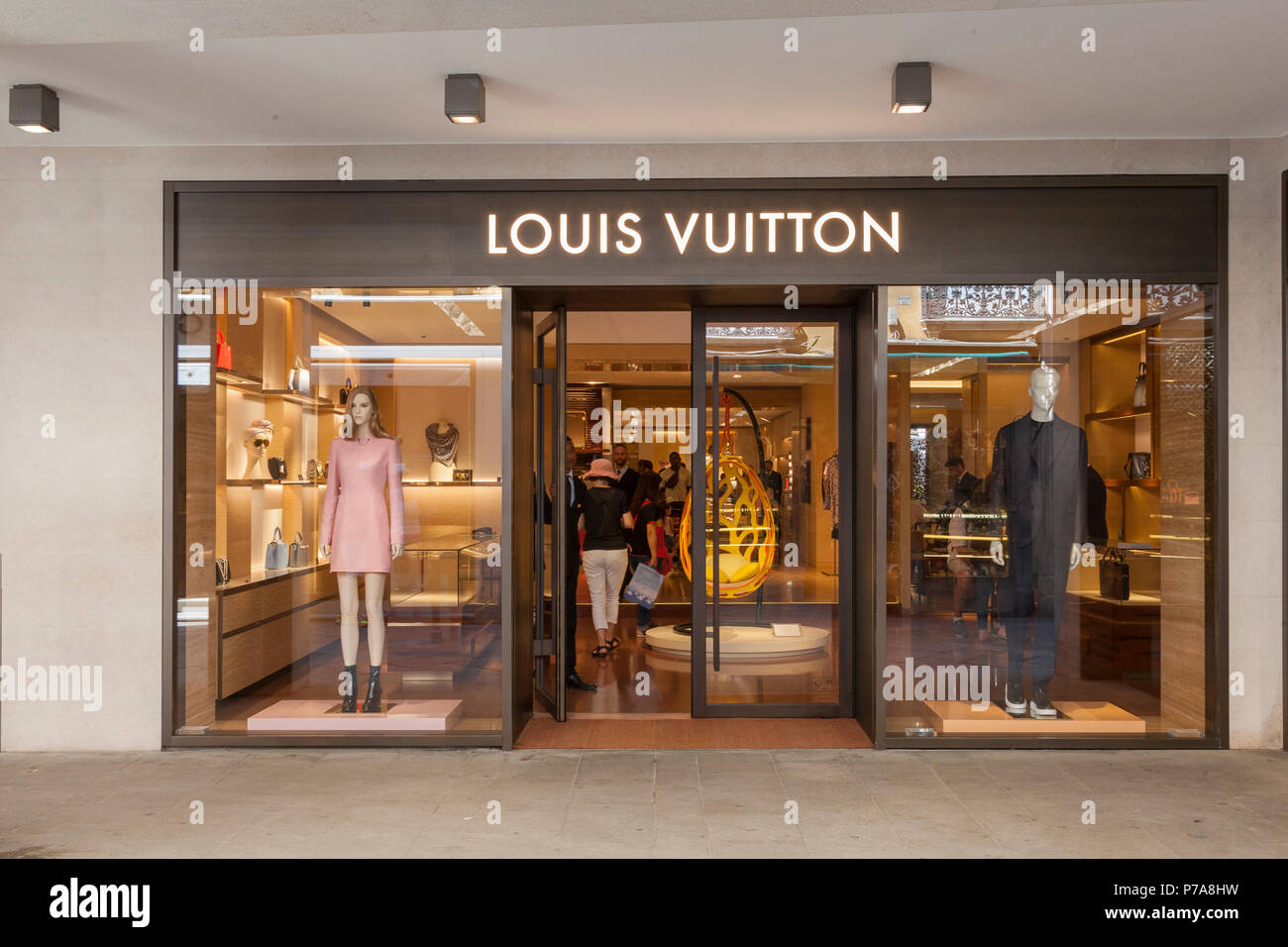Louis Vuitton retail outlet, Piazza San Marco, Venice, Veneto, Italy with the door open as a ...