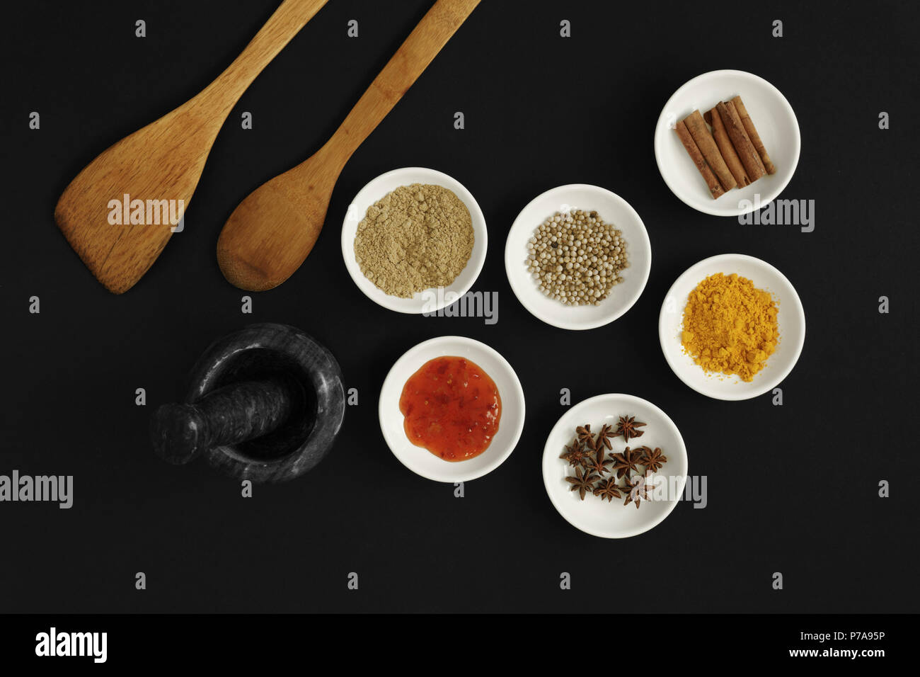 Asian spices, herbs and cooking ingredients on black background. Stock Photo