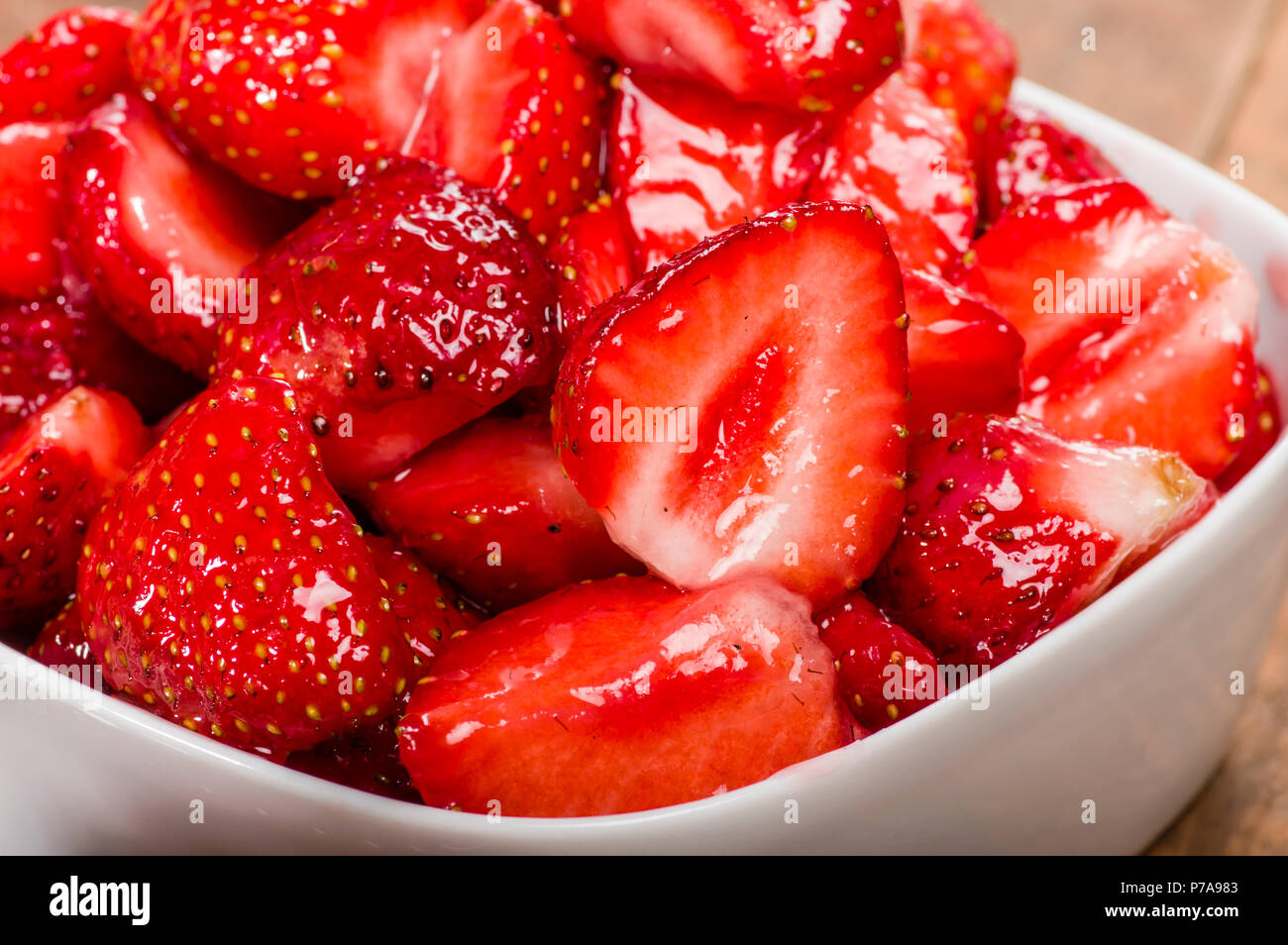 Bowl of red ripe glazed strawberries ready to serve Stock Photo