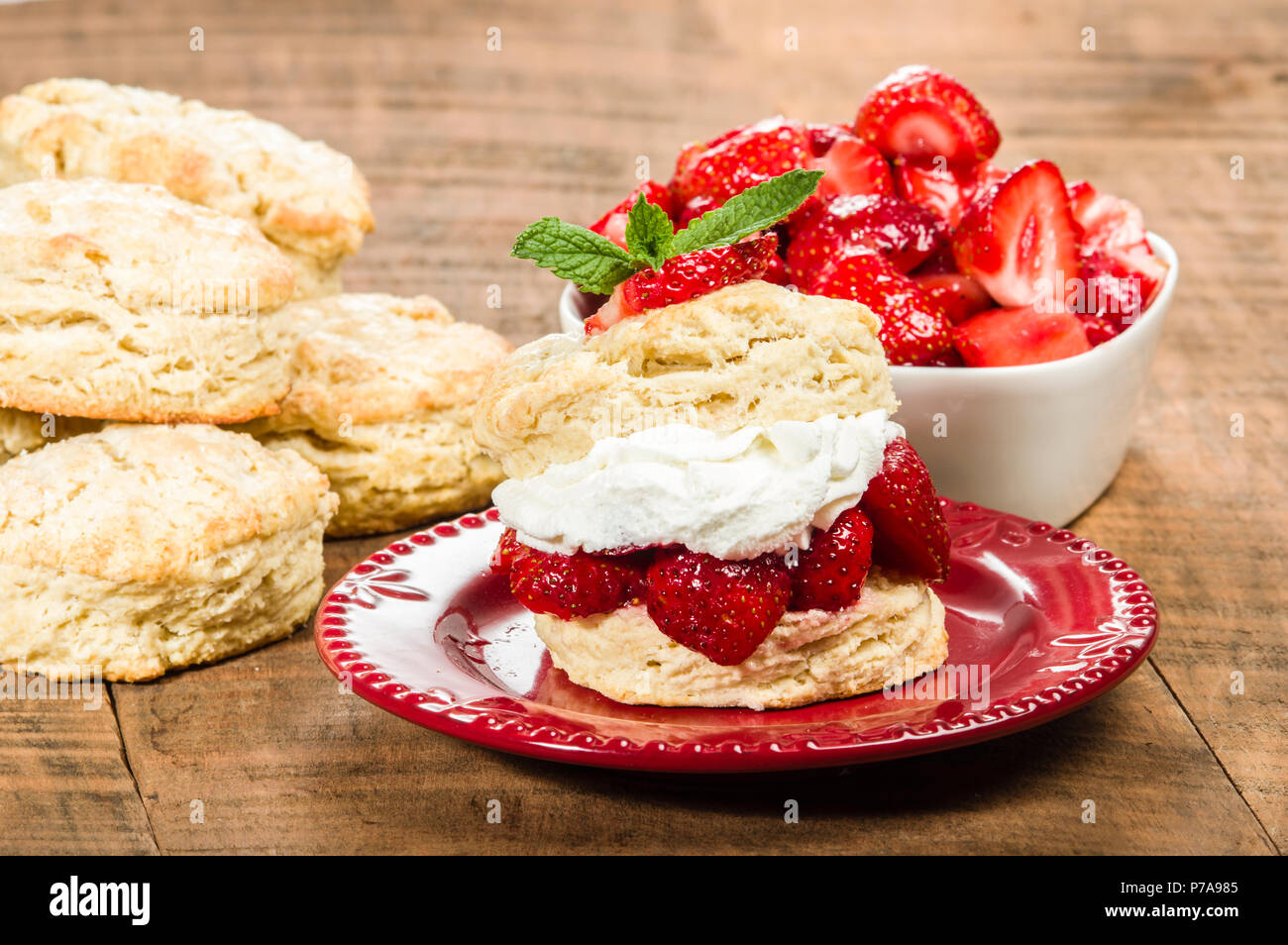 Red plate with strawberry biscuit dessert Stock Photo