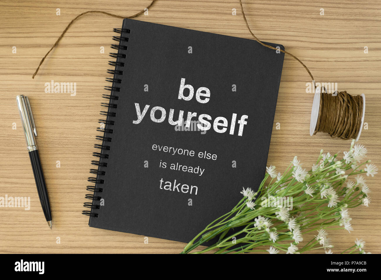 Notebook With Motivational And Inspirational Wisdom Quote On Wood