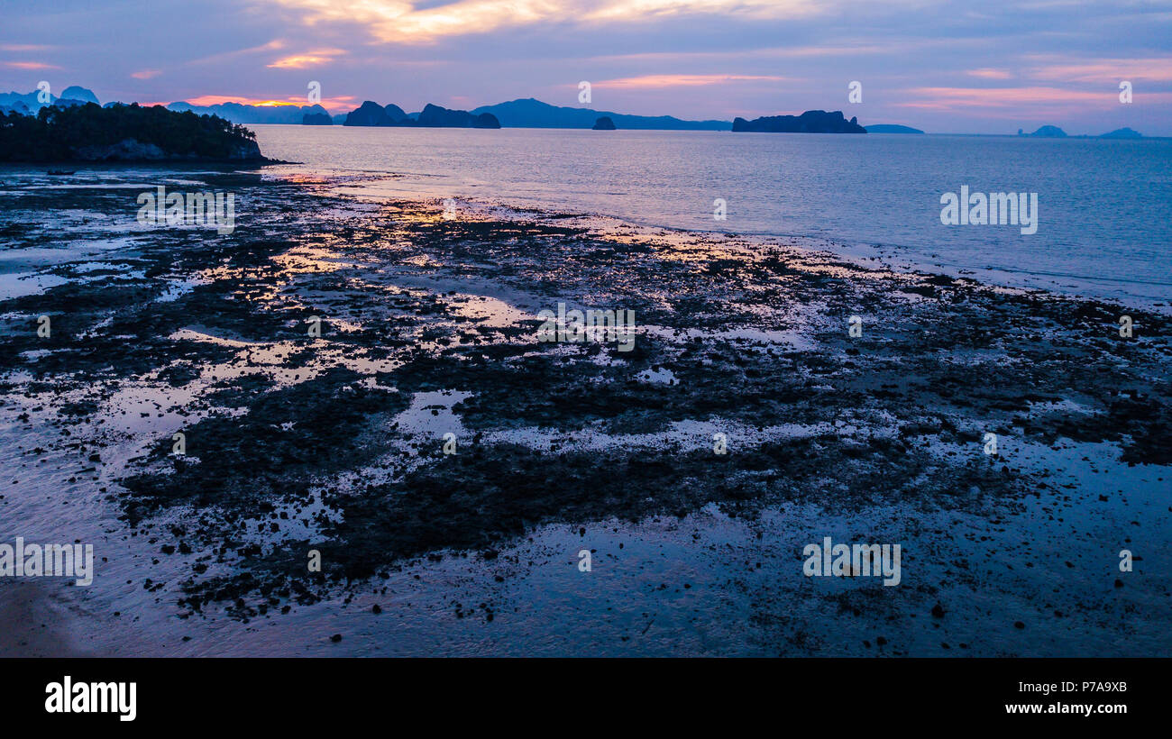 landscape of sunset and fishing boat Stock Photo - Alamy