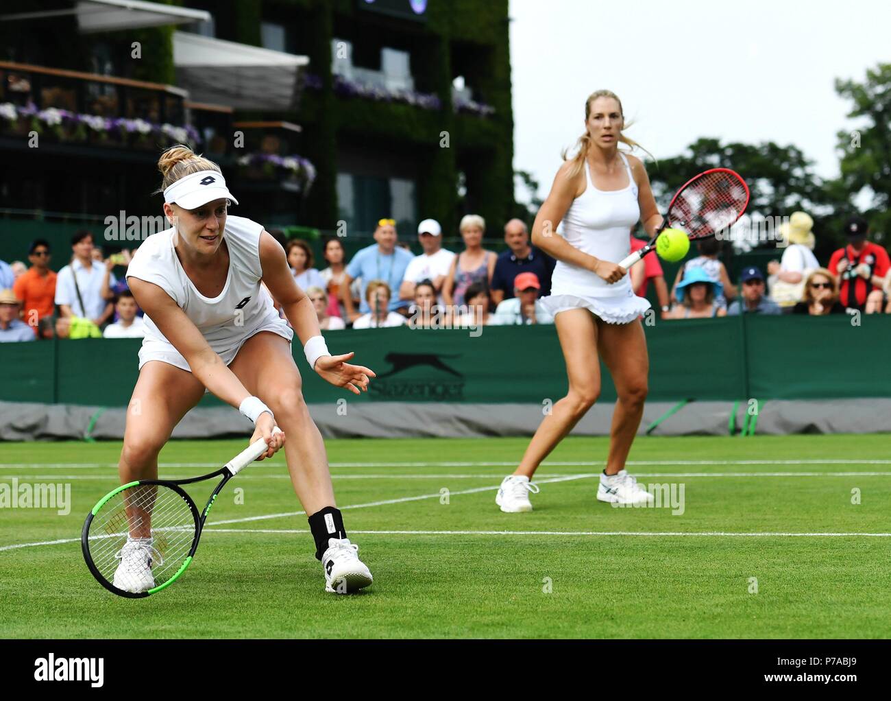 London, UK. 4th July, 2018. Olga Savchuk of Ukraine and Alison Riske (L) of the United States compete during the women's doubles first round match against Xu Yifan of China and Gabriela Dabrowski of Canada at the Wimbledon Championships 2018 in London, UK, on July 4, 2018. The match was suspended due to the rain. Credit: Guo Qiuda/Xinhua/Alamy Live News Stock Photo