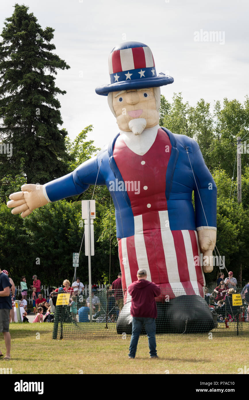 Anchorage, Alaska. 4th July, 2018. A giant Uncle Sam inflatable decorates Delaney Park during the annual Independence Day parade July 4, 2018 in Anchorage, Alaska. Credit: Planetpix/Alamy Live News Stock Photo