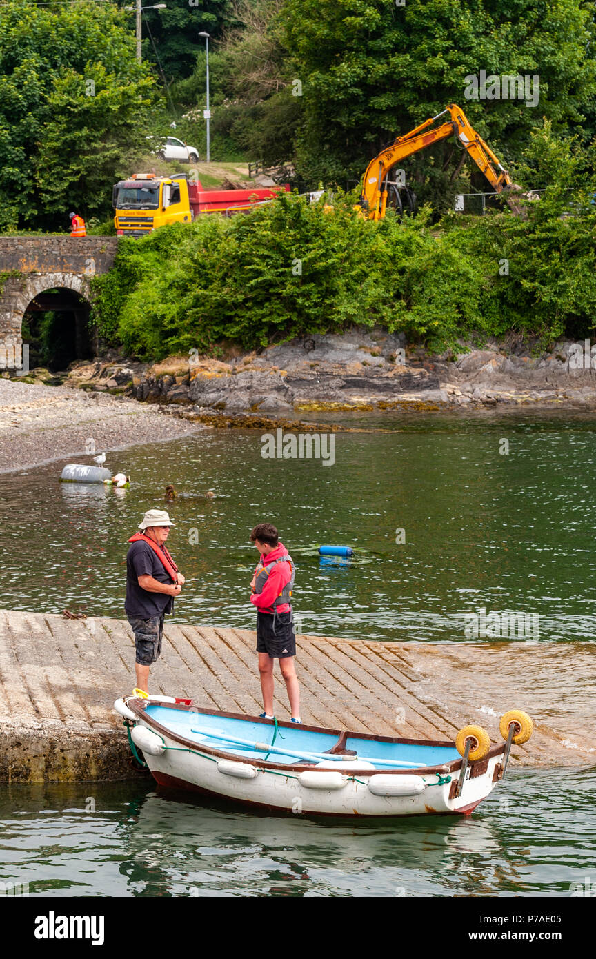 Schull, West Cork, Ireland . Boaters prepare to cast off for a day's boating whilst work on the new pontoon for Schull Harbour continues in the background. After a cool and overcast start to the day, temperatures are beginning to rise with highs of around 30° Celsius expected over the weekend and into next week. Credit: Andy Gibson/Alamy Live News. Stock Photo