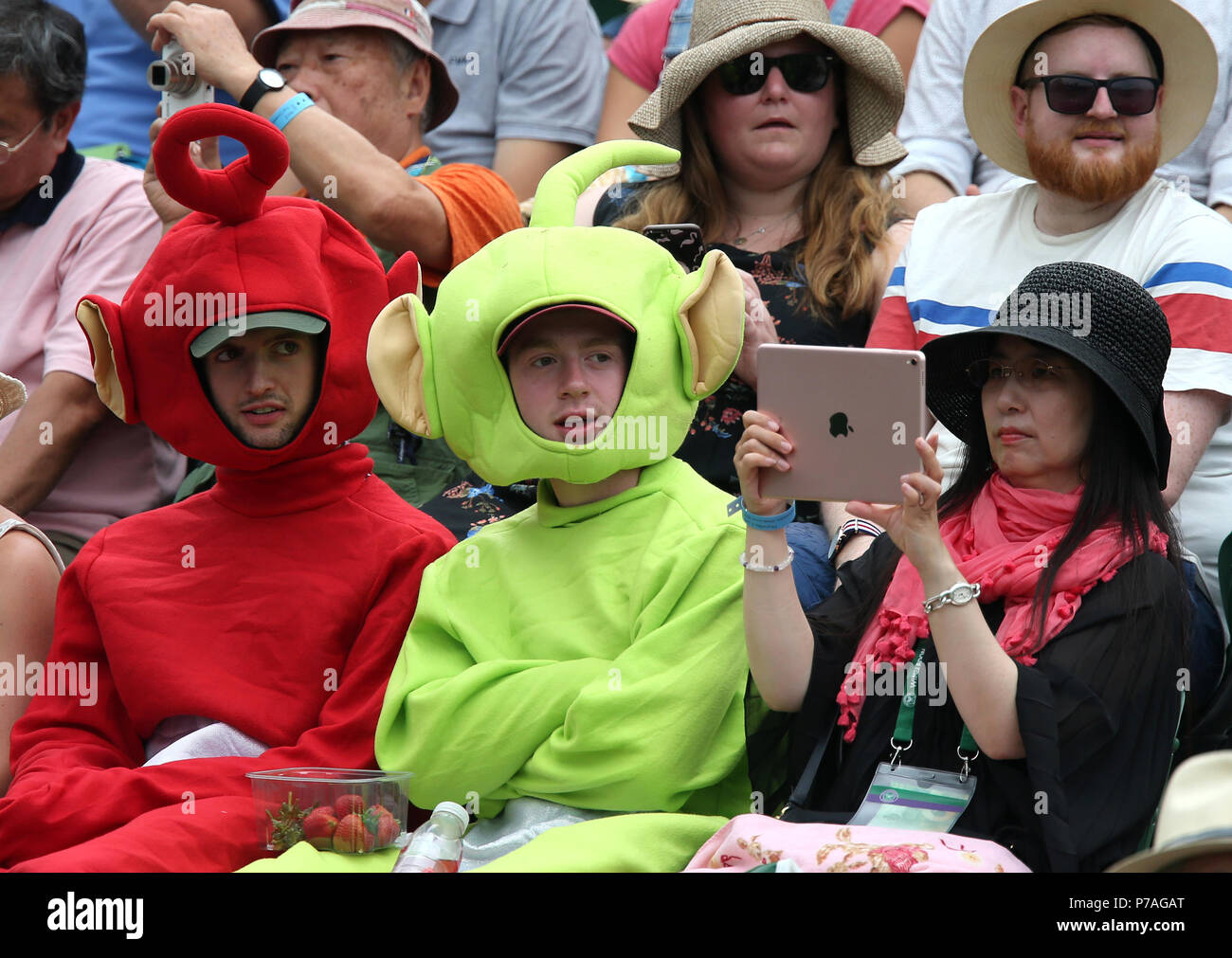 FANS DRESSED UP AS TELETUBBIES, THE WIMBLEDON CHAMPIONSHIPS 2018, THE WIMBLEDON CHAMPIONSHIPS 2018 THE ALL ENGLAND TENNIS CLUB, 2018 Stock Photo