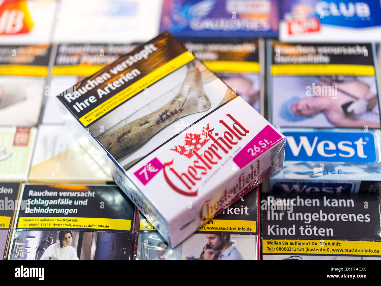 ILLUSTRATION - 4 July 2018, Dresden, Germany: Cigarette boxes with shock imagery printed on them can be seen on stores shelves. Do pictures of decaying teeth and black lungs have to be exhibited at the sales shelves in supermarkets? The Bavarian Association 'Pro Rauchfrei' (lit. 'Pro Smoke Free') has answered affirmatively and is currently sueing. The 5th of July will see the sentencing at the district court in Munich. Photo: Monika Skolimowska/dpa-Zentralbild/dpa Stock Photo