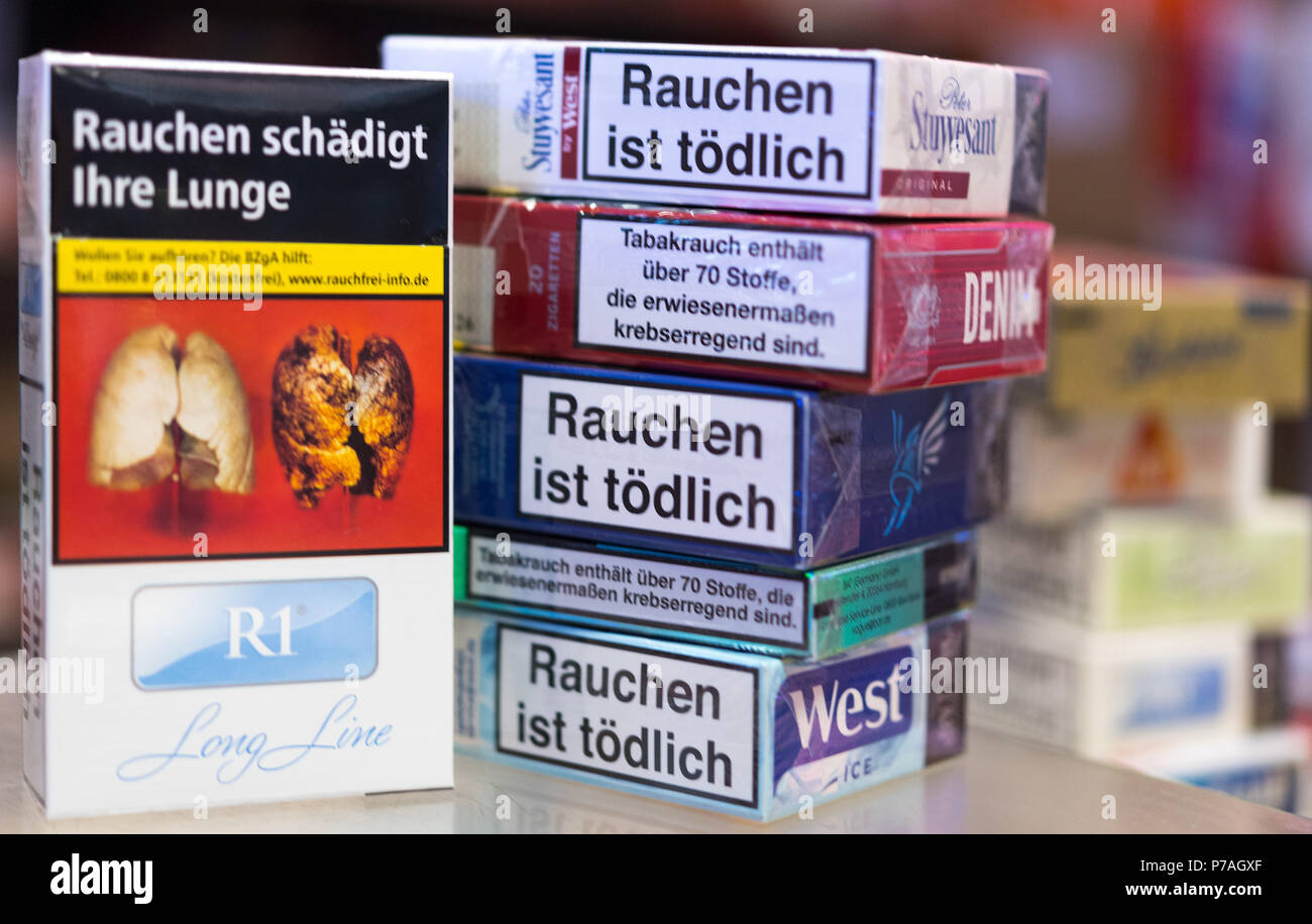 ILLUSTRATION - 4 July 2018, Dresden, Germany: Cigarette boxes with shock imagery printed on them can be seen on stores shelves. Do pictures of decaying teeth and black lungs have to be exhibited at the sales shelves in supermarkets? The Bavarian Association 'Pro Rauchfrei' (lit. 'Pro Smoke Free') has answered affirmatively and is currently sueing. The 5th of July will see the sentencing at the district court in Munich. Photo: Monika Skolimowska/dpa-Zentralbild/dpa Stock Photo