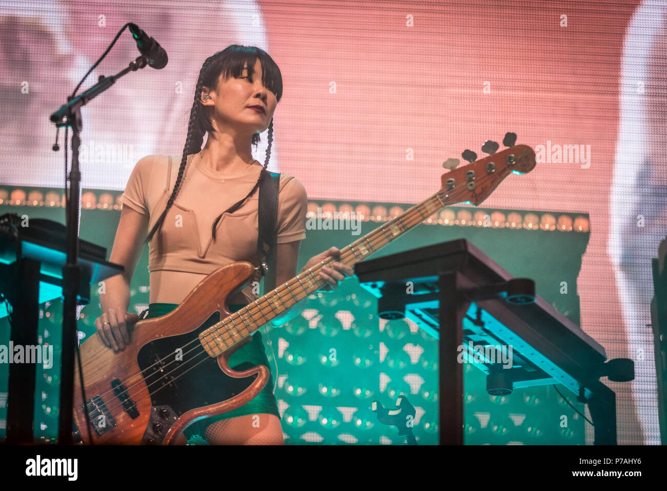 Denmark, Roskilde - July 4, 2018. The American singer, songwriter and musician St. Vincent performs a live concert during Danish music festival Roskilde Festival 2018. Here musician Toko Yasuda is seen live on stage. (Photo credit: Gonzales Photo - Thomas Rasmussen). Credit: Gonzales Photo/Alamy Live News Stock Photo