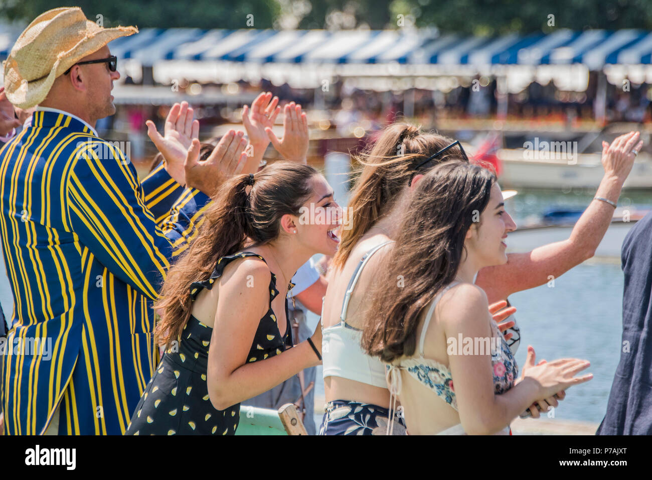 Henley on Thames, UK. 5th July, 2018. The crowd in the stewards enclosure gets very excited  as a Latymer Upper D Four passes. It was the first ever J16 boat to qualify for the senior races at Henley - Henley Royal Regatta. Credit: Guy Bell/Alamy Live News Stock Photo