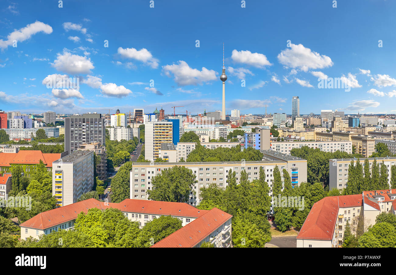 Eastern Berlin from above: panoramic view over modern buildings, television tower on Alexanderplatz and city skyline in Summer Stock Photo