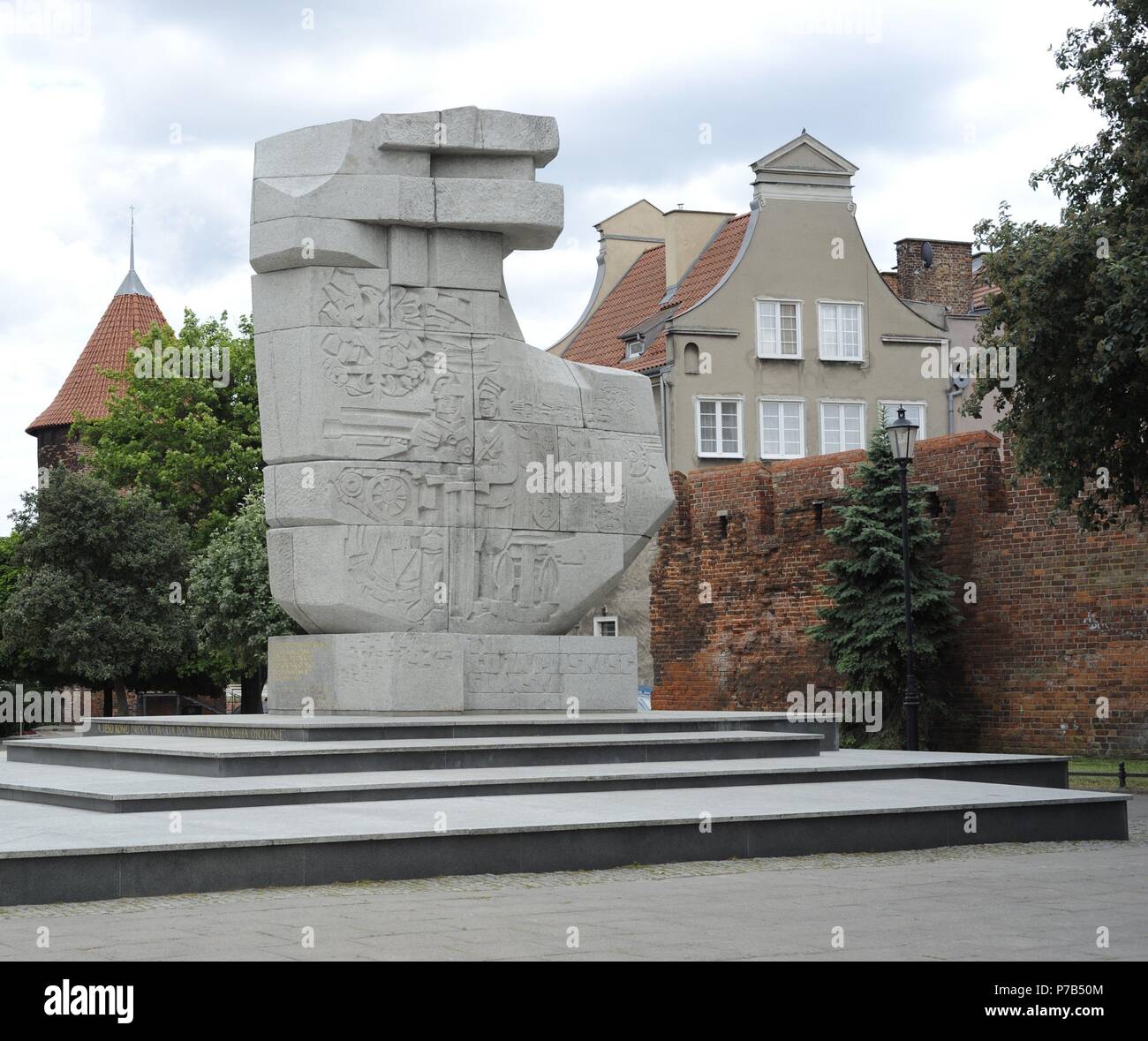 Poland. Gdansk. Monument to Those Who Fell in a fight for the Polish Character in the period from the Gdansk massacre, 1308, until the end of II World War. Erected in 1969 by Wawrzyniec Samp (b. 1939) and Wies aw Pietron (b. 1934) and symbolises an axe stuck in the ground. Square at Podwale Staromiejskie Street. Stock Photo