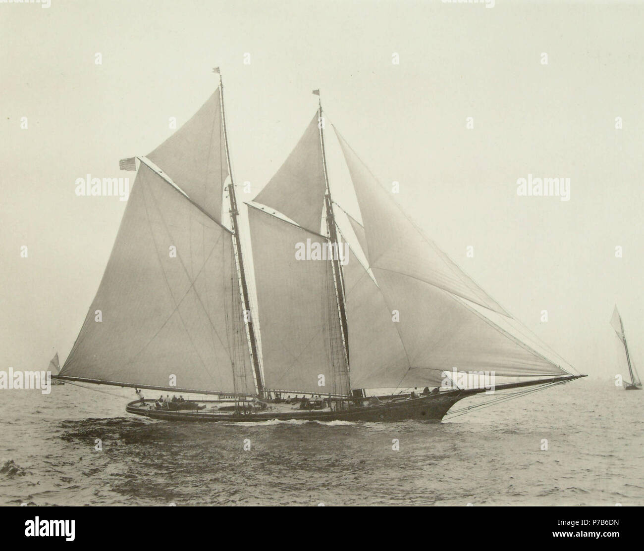 English: the yankee schooner America won the 1851 RYS £100 Cup for a New York Yacht Club syndicate. She was designed by George Steers, built at Henry H. Brown's shipyard in Brooklyn in 1851, and is shown here in a 1887 photograph by Nanthaniel Livermore Stebbins) which has served on a book cover: 'America's Victory' (David W. Shaw, Free Press 2002) Note that this is not America's rig as that with which she won the £100 Cup in 1851: Donald McKay and Edward Burgess refitted her in 1875 and 1885 respectively. By 1887, the rake in her masts was reduced, all her spars were lengthened, she featured  Stock Photo