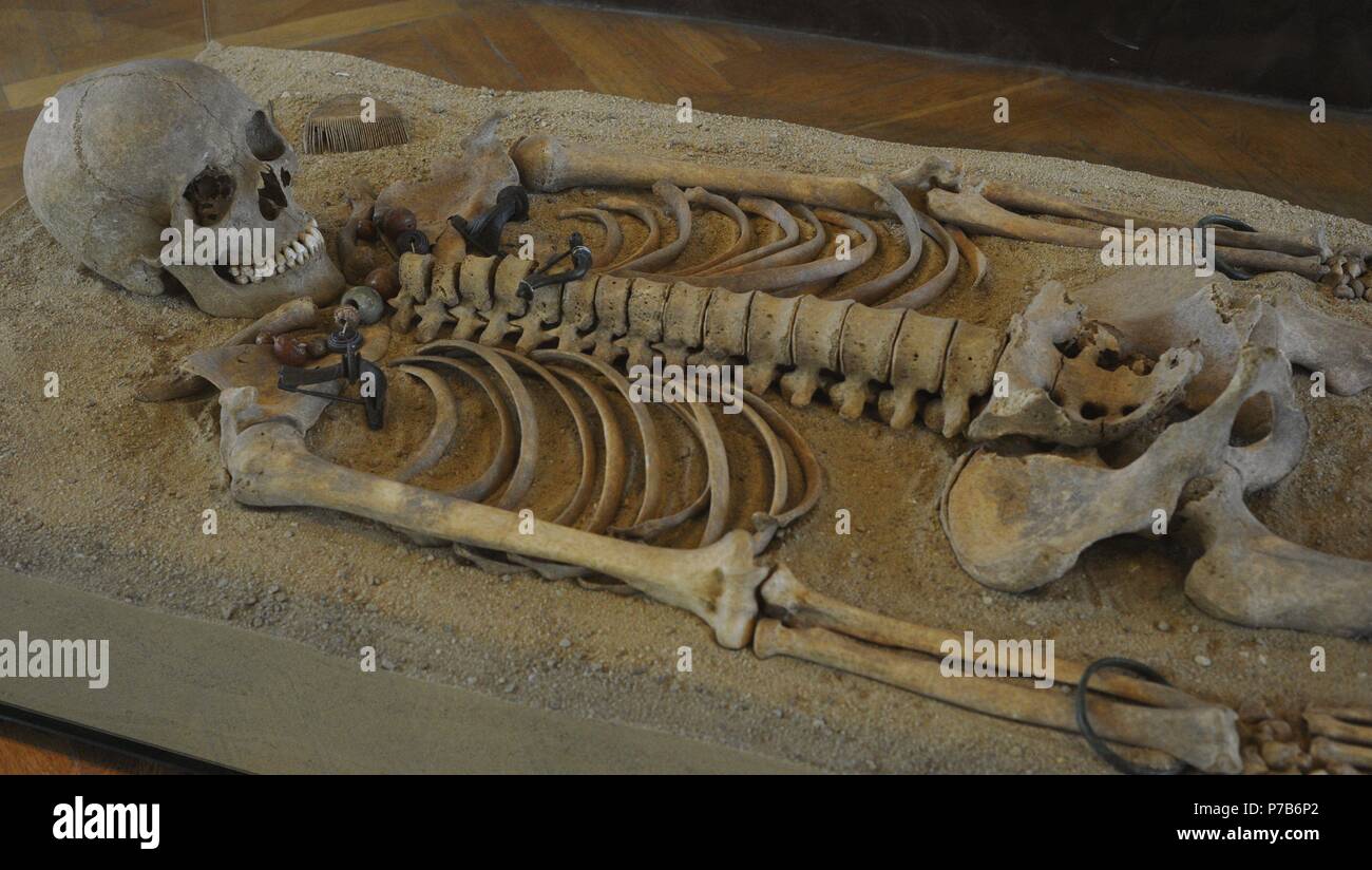 Roman era. Tomb with skeleton. Grave goods: Brooch, necklace, belt, buckles, bracelets, hair needle. Pruszcz Gdanski, Poland. 2nd century. Archeological Museum of Gdansk. Poland. Stock Photo