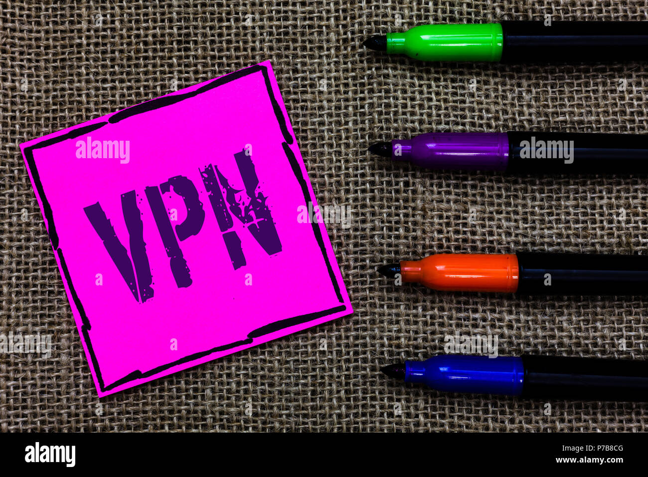 Writing note showing Vpn. Business photo showcasing Secured virtual private network across confidential domain protected Marker pens art pink paper ni Stock Photo