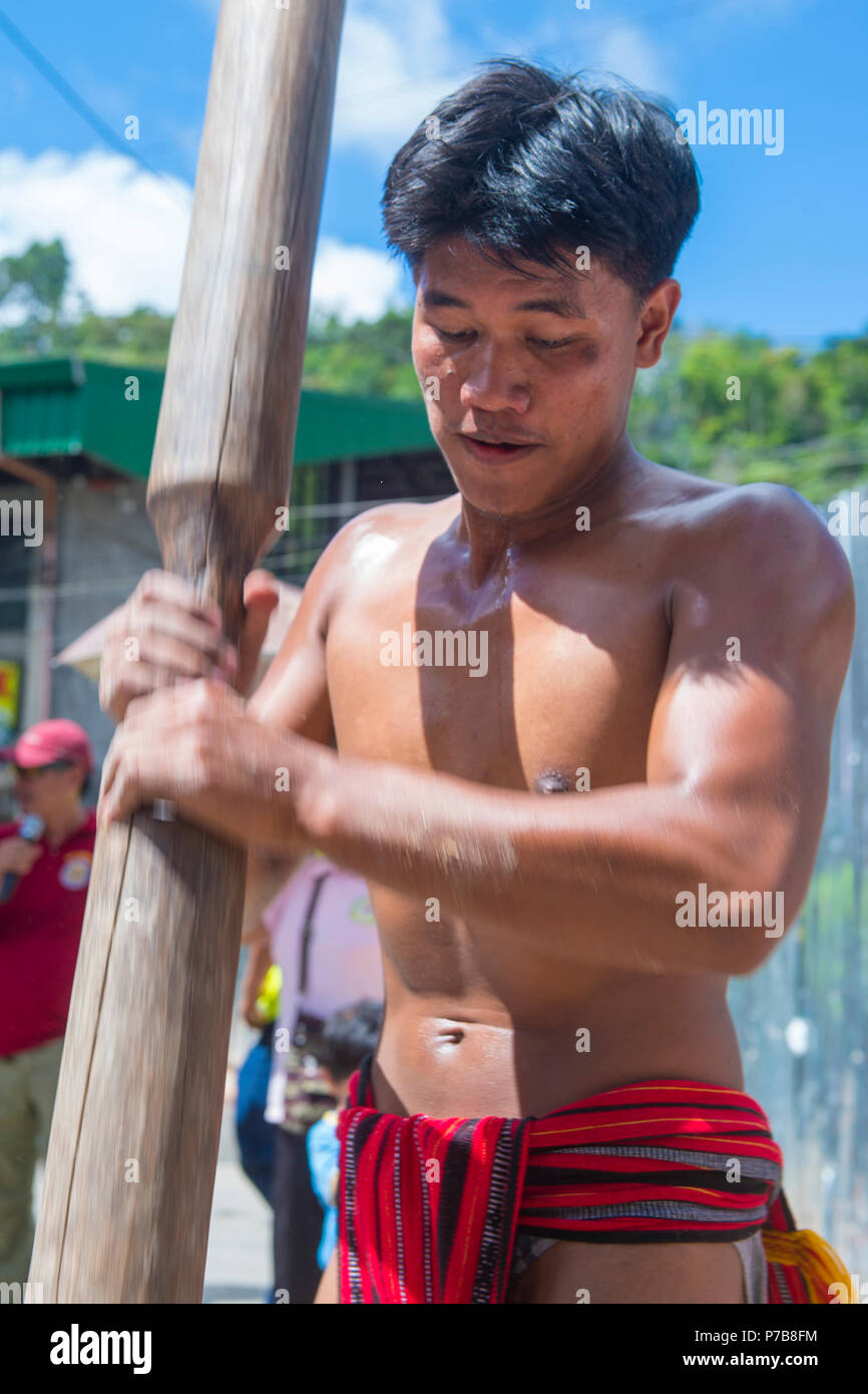 Man from Ifugao Minority in a rice pounding competion during Imbayah