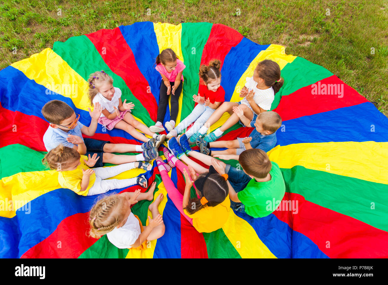 Kids holding hands together with teacher in gym Stock Photo - Alamy