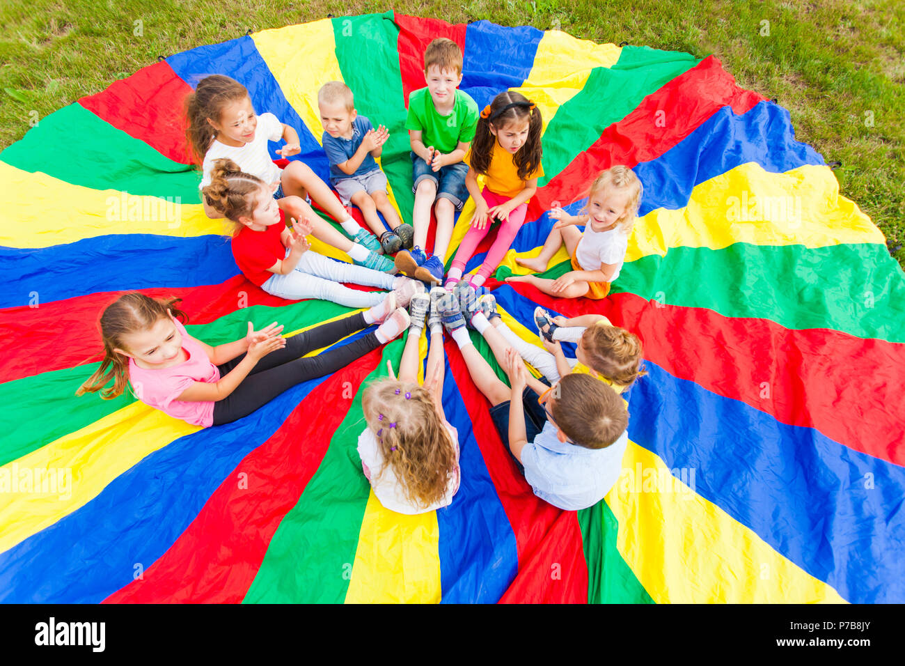 Kids Holding Hands Together With Teacher In Gym Stock Photo - Alamy