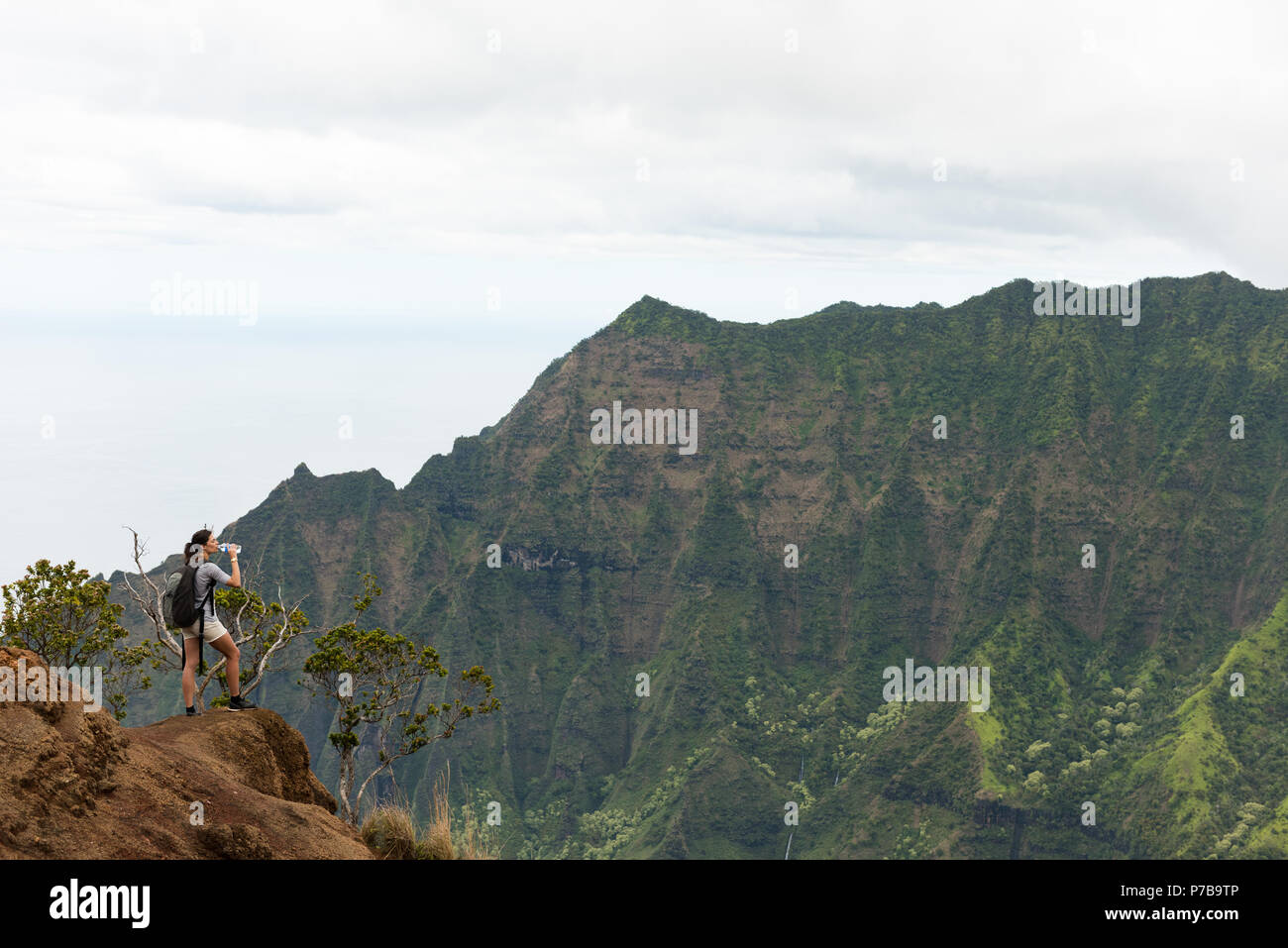 Woman standing on top mountain hi-res stock photography and images - Alamy