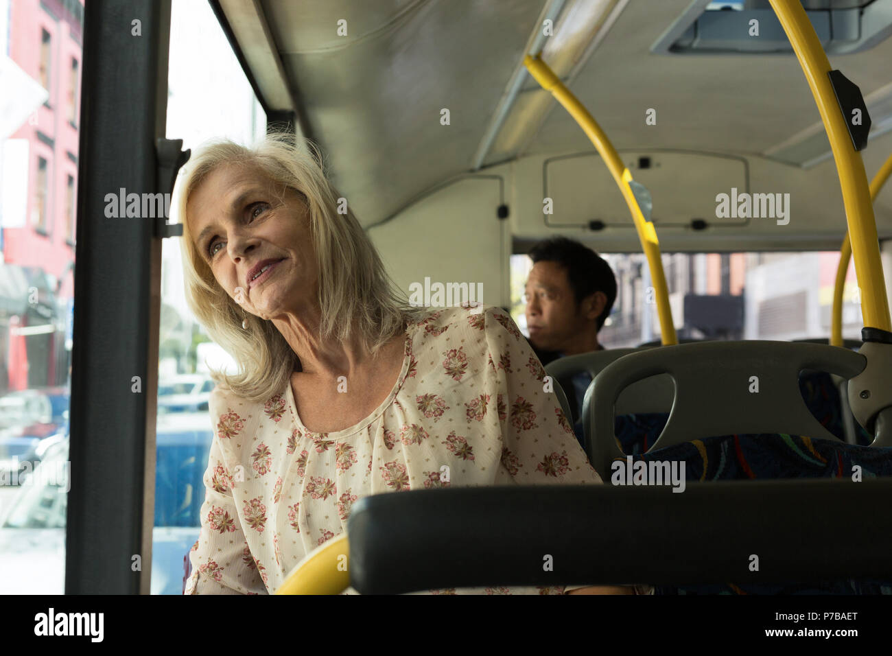Senior woman travelling in the bus Stock Photo