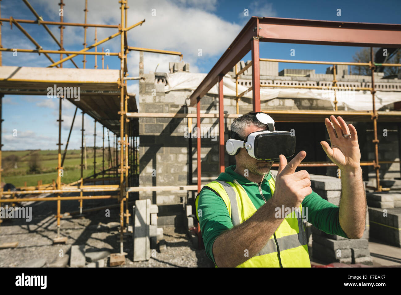 Engineer experiencing VR headset at the construction site Stock Photo
