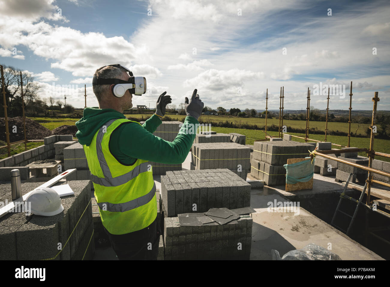 Engineer experiencing VR headset at the construction site Stock Photo
