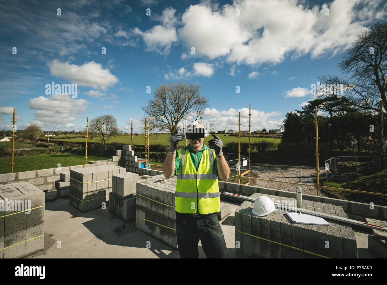 Engineer experiencing VR headset at the construction site Stock Photo