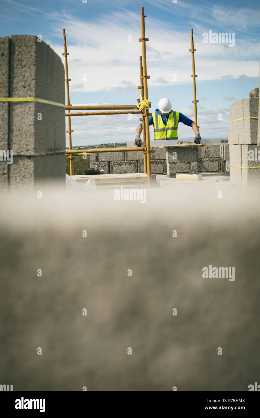 Engineer doing at level check on the wall Stock Photo