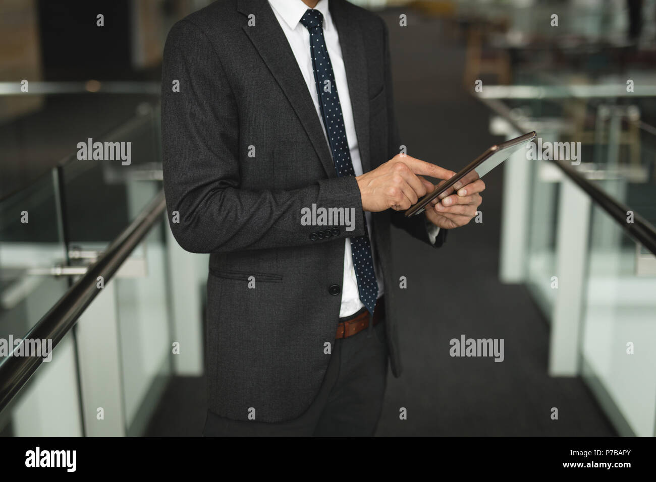 Businessman using a digital tablet in the office Stock Photo