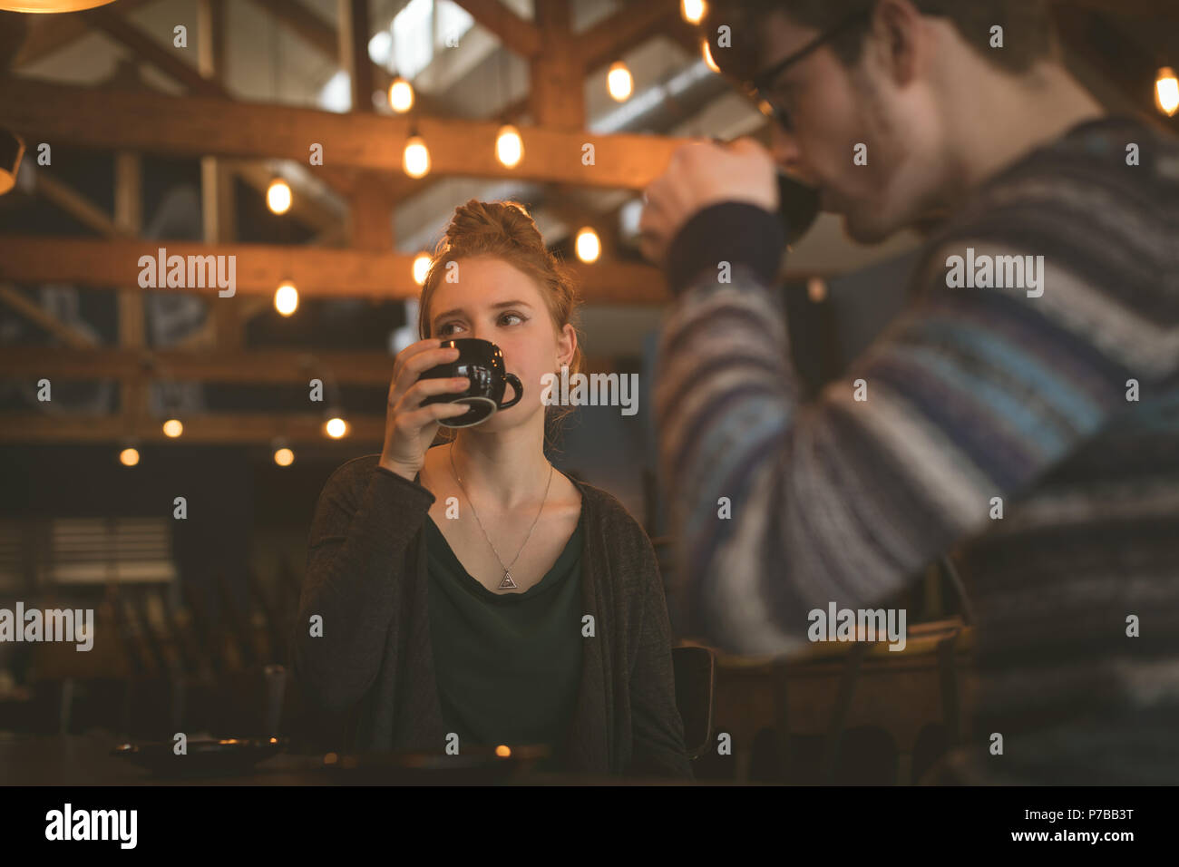 Couple having coffee at the counter Stock Photo