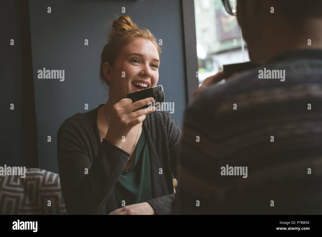 Smiling couple having coffee at the cafe Stock Photo