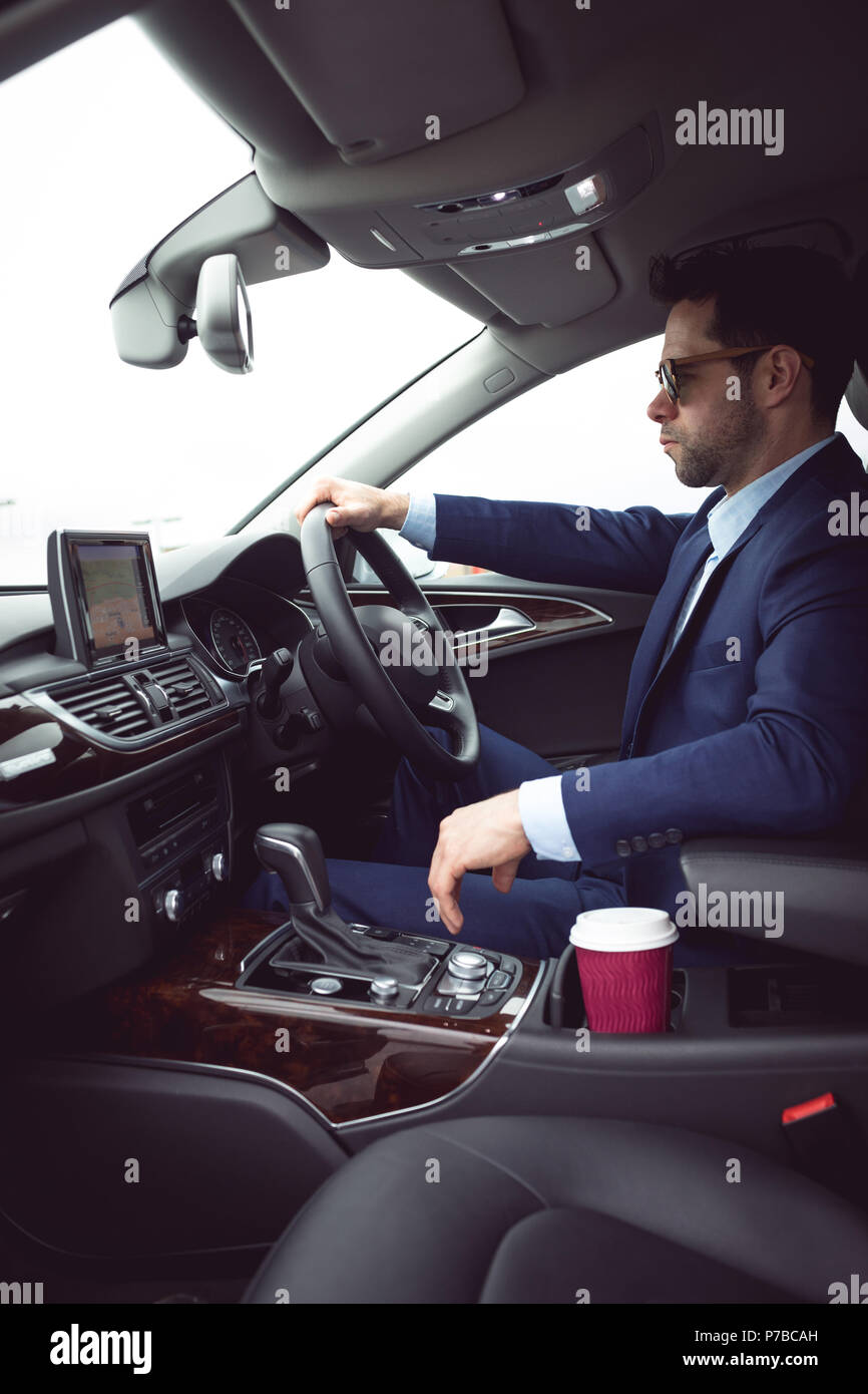 Businessman driving a car Stock Photo