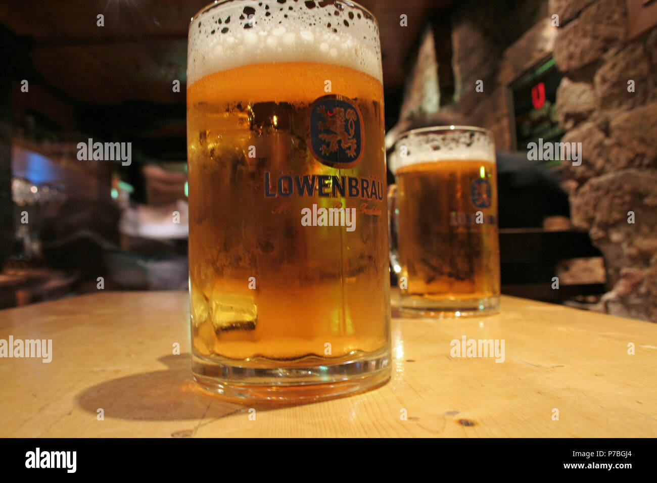 Glasses of German beer, Lowenbrau, Sydney, New South Wales, Australia Stock Photo