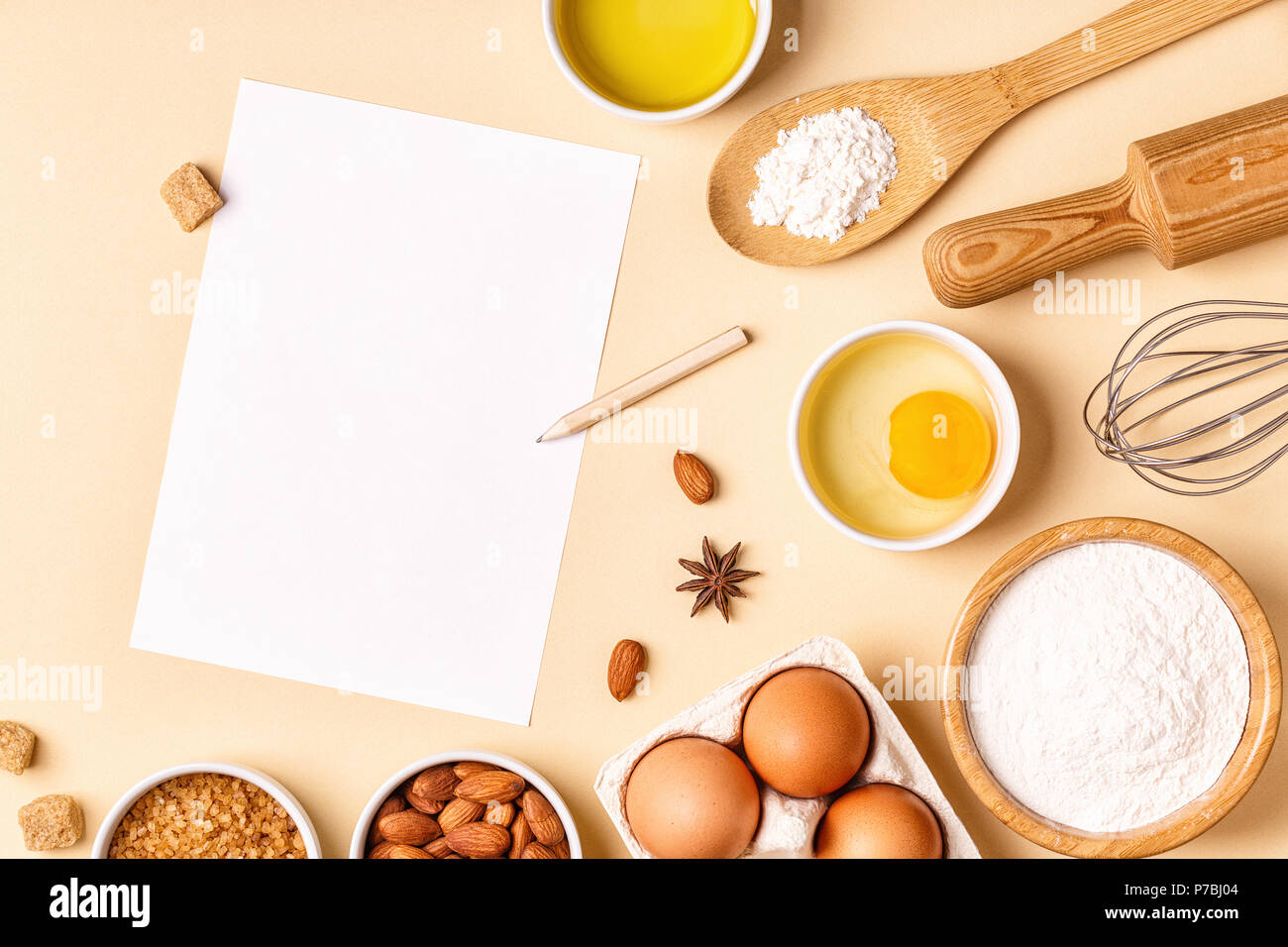 Ingredients and utensils for baking on a pastel background, top view