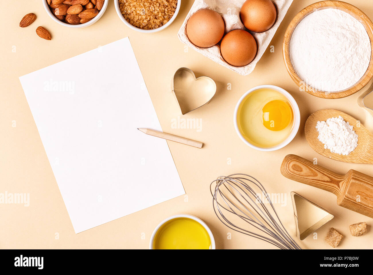 Ingredients and utensils for baking on a pastel background, top view