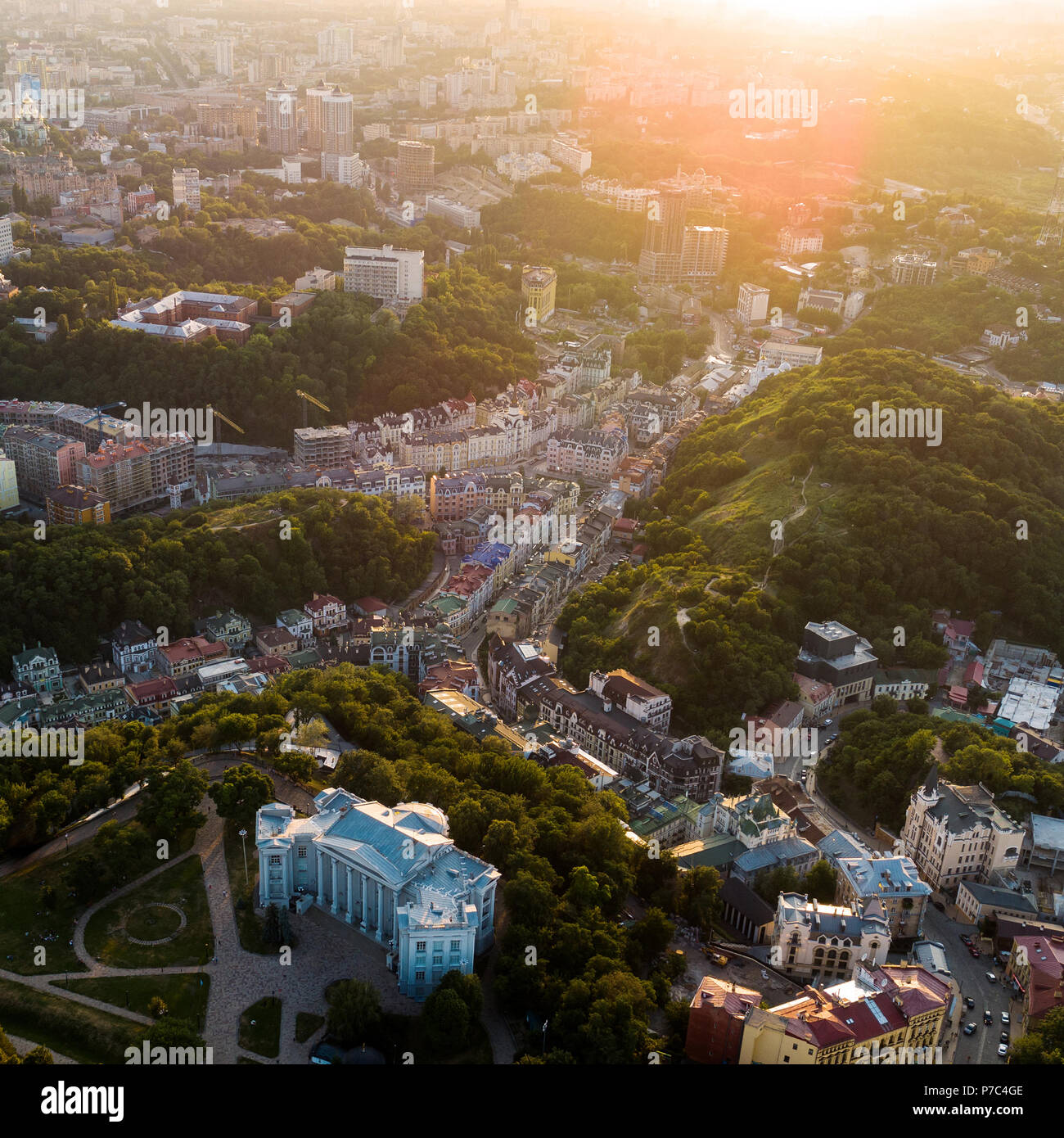 Aerial Panoramic view to the Andreevsky Descent at sunset with the St. Andrew's Church and emerald hills Stock Photo