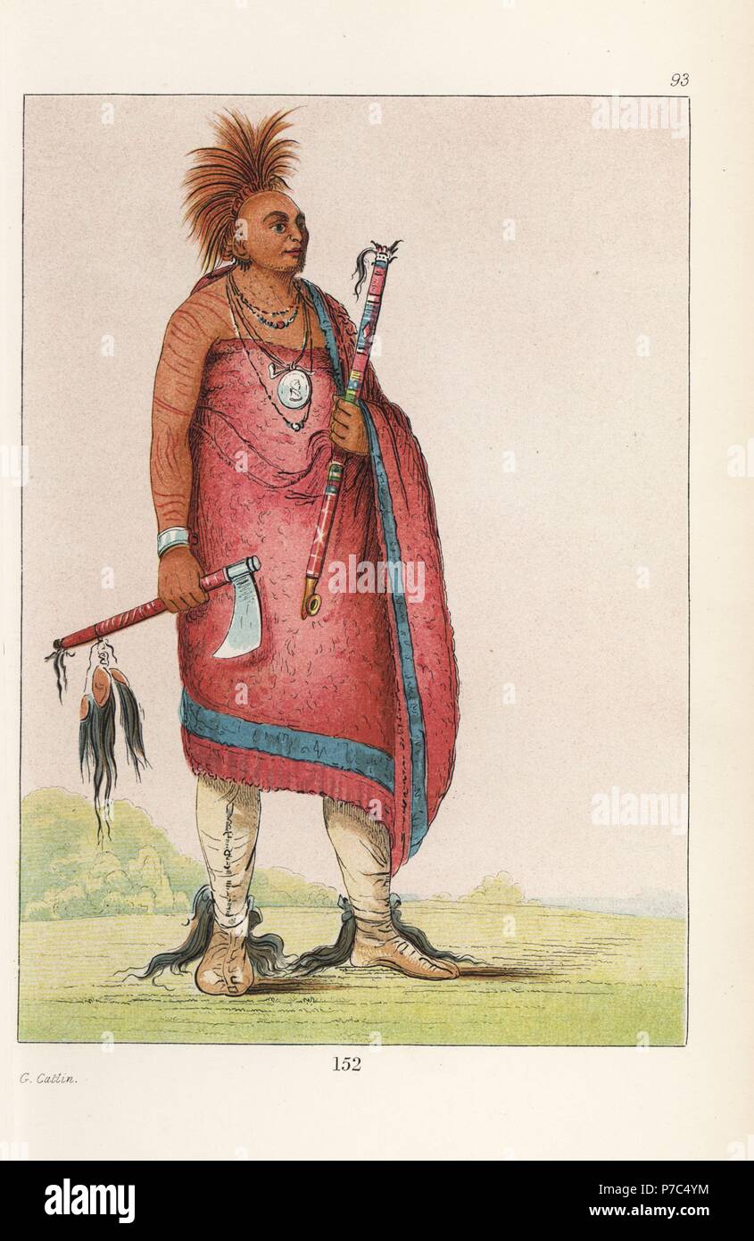 Chief Tehong-tas-sab-bee, Black Dog, of the Osage nation with tobacco pipe, tomahawk with scalp-locks, shaved head with dyed-red deer hair crest, moccasins with scalps, and mackinaw blanket. Handcoloured lithograph from George Catlin's Manners, Customs and Condition of the North American Indians, London, 1841. Stock Photo