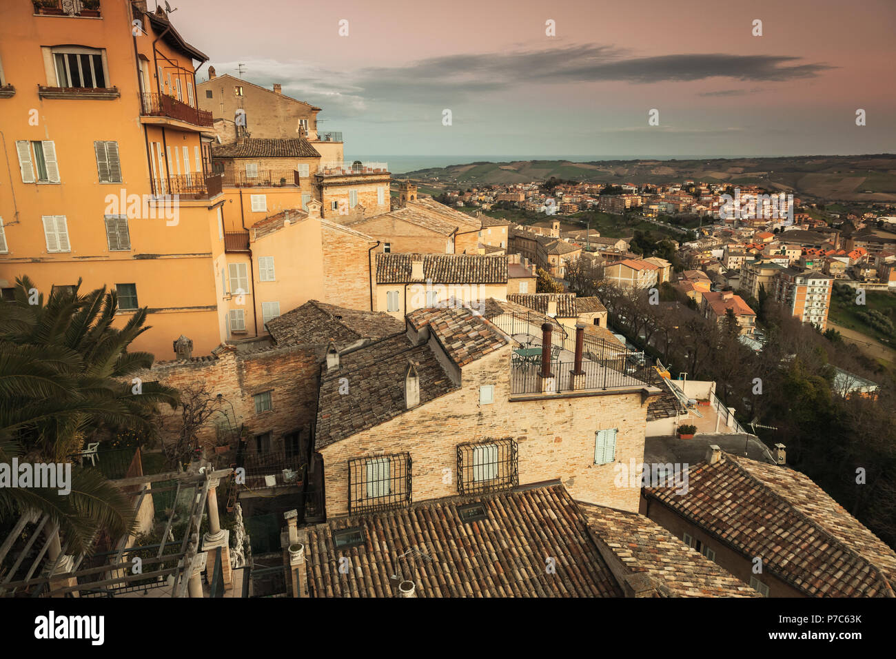 Cityscape of Fermo, old Italian town. Vintage stylized photo with warm tonal correction Stock Photo