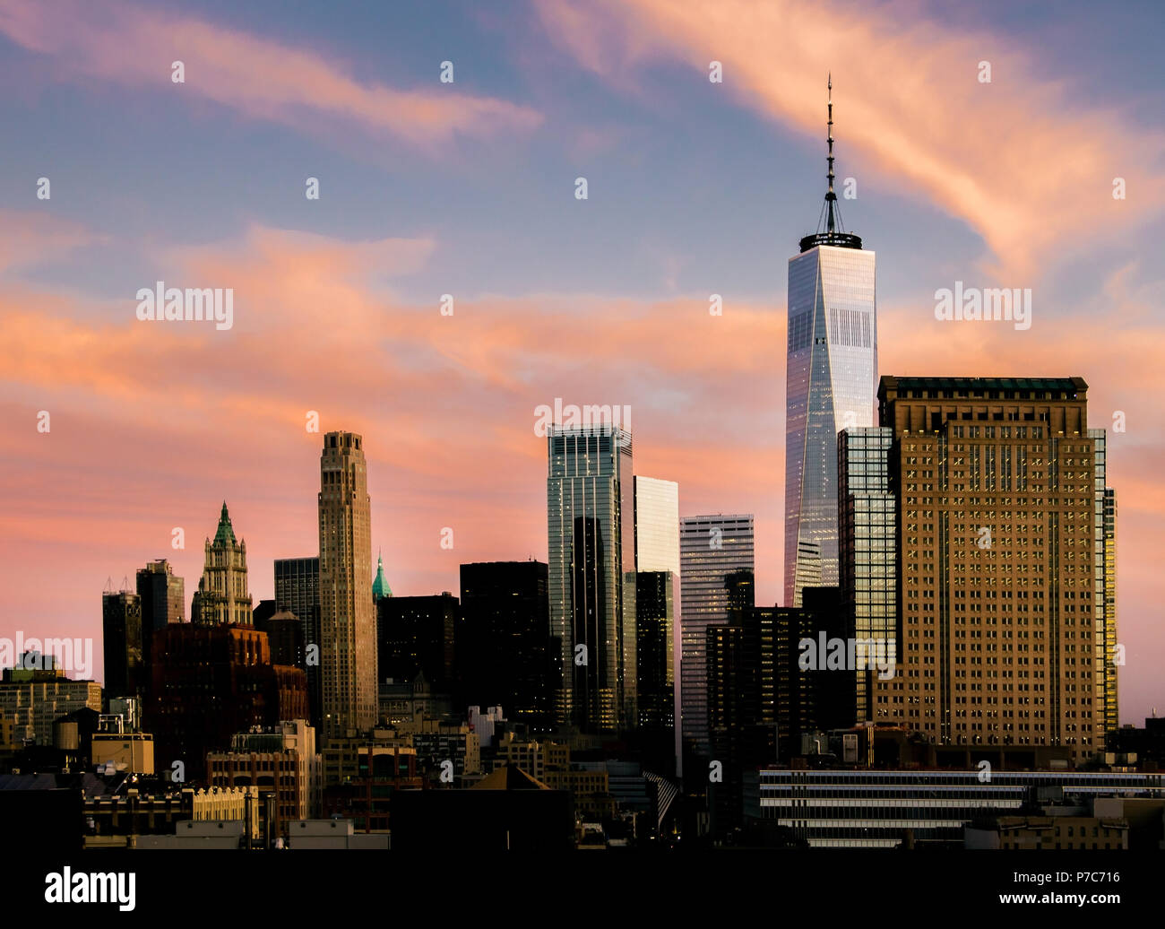 Manhattan, New York City, USA sunset downtown skyline skyscrapers at Magenta coloured sunset Stock Photo
