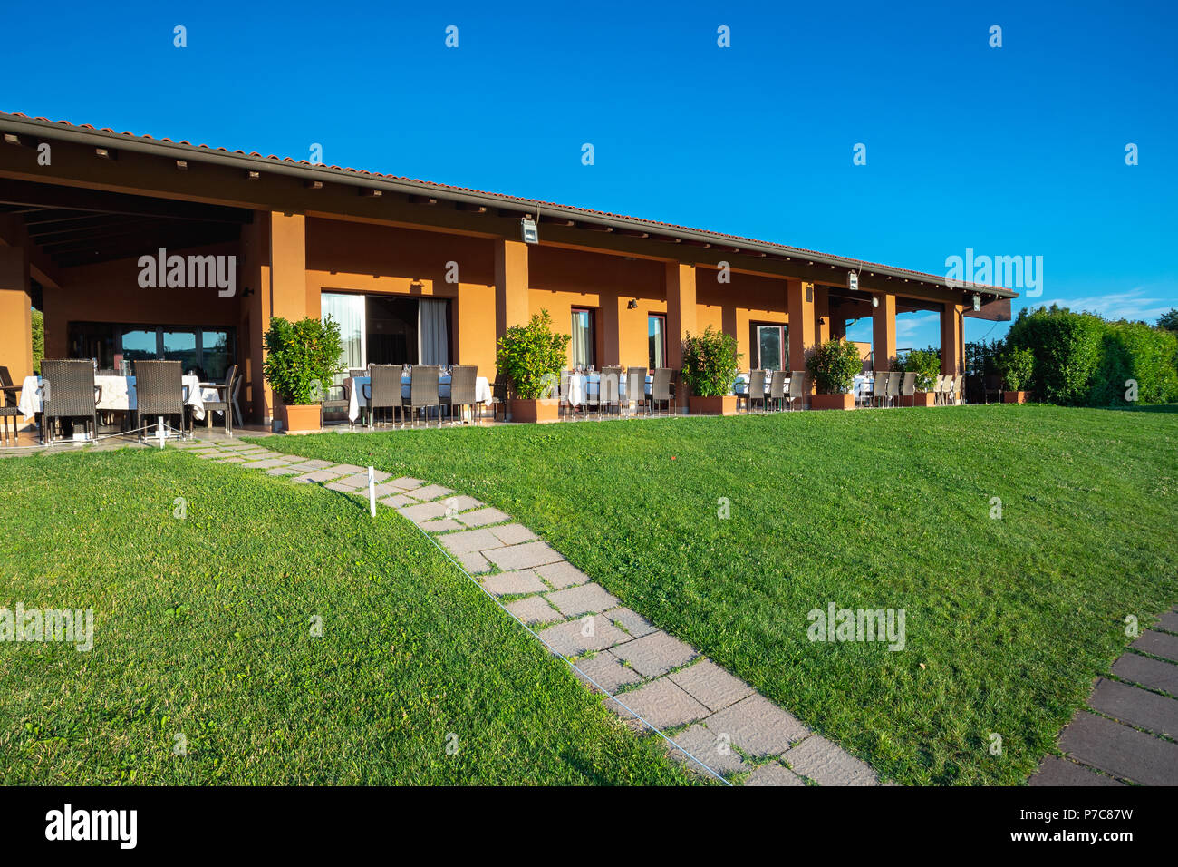 Outdoor restaurant terrace on golf club Le Fonti in Castel San Pietro Terme,  Italy Stock Photo - Alamy