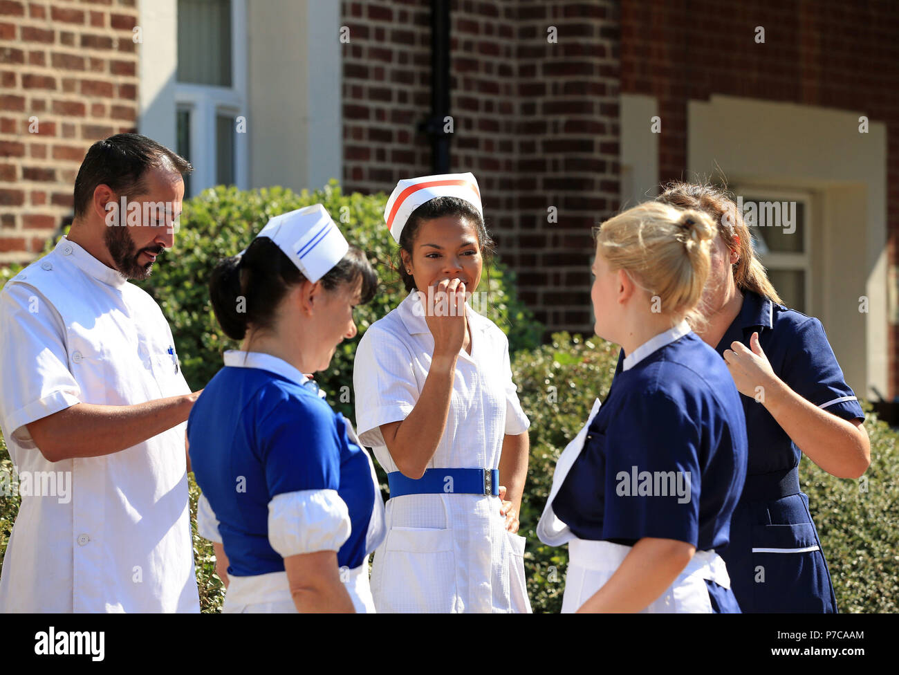 Nurses dressed in uniforms from the past 70 years outside Trafford General Hospital in Manchester, to mark the 70th anniversary of the NHS. Stock Photo