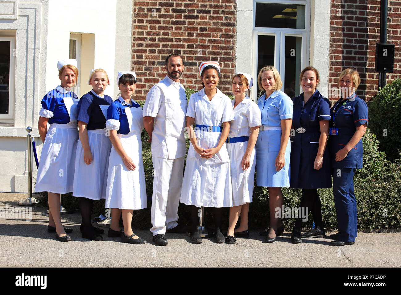 Nurses dressed in uniforms from the past 70 years, outside Trafford General Hospital in Manchester to mark the 70th anniversary of the NHS. Stock Photo