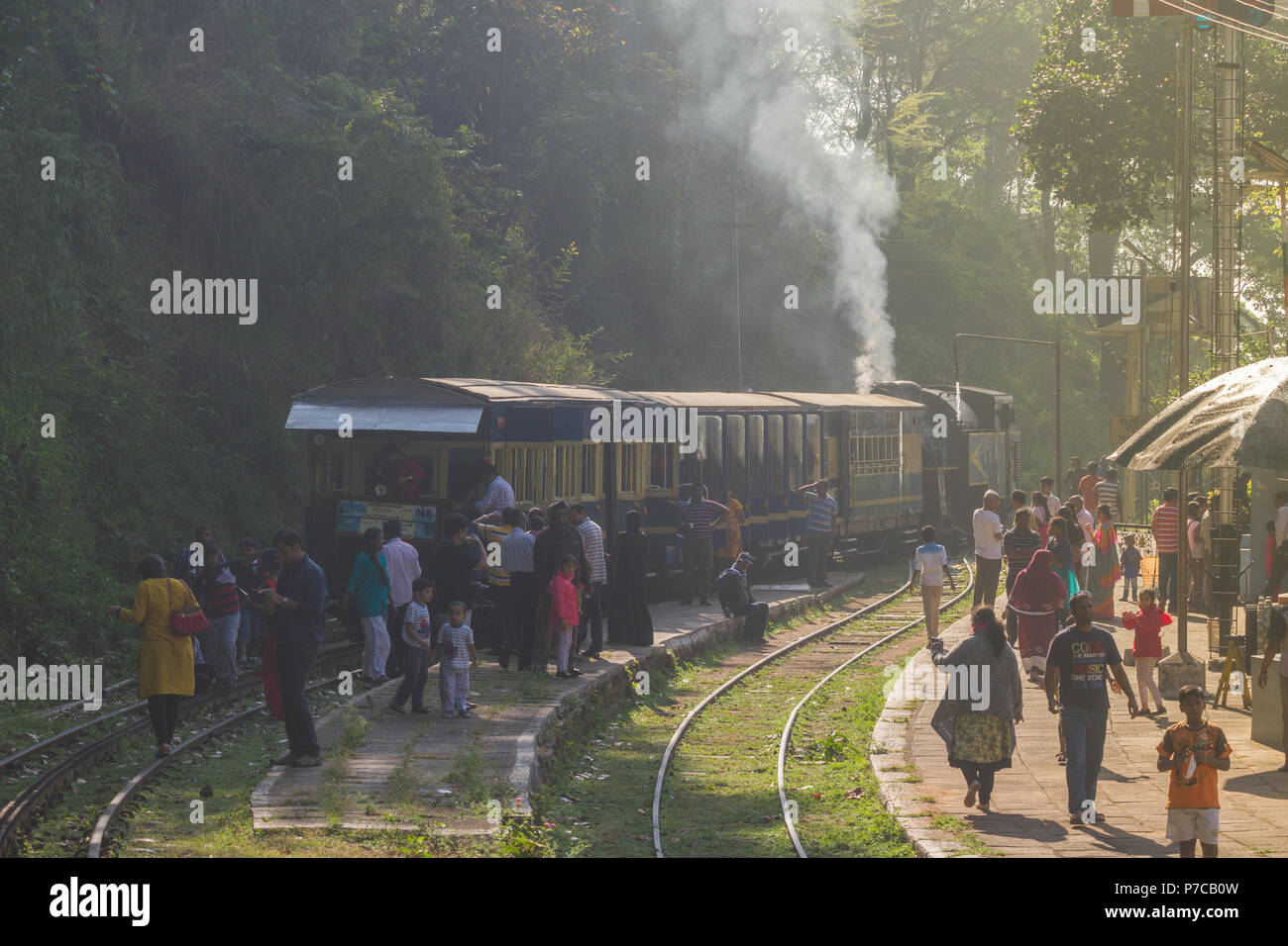 OOTY, TAMIL NADU, INDIA, 20 March 2015 : Nilgiri mountain railway. Blue train. Unesco heritage. Narrow-gauge. A lot of locals people on train station Stock Photo