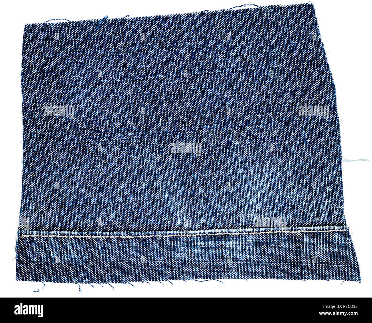 Cut of blue jeans fabric isolated on white background. Rough uneven