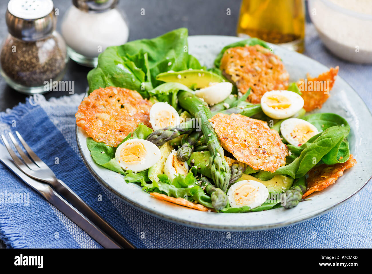 Asparagus Salad with quails eggs, avocado and cheese crisps, healthy