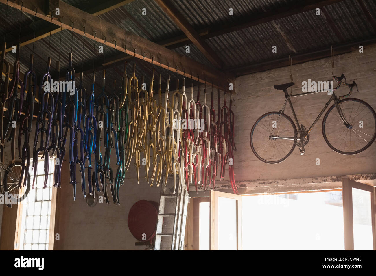 Bicycle and bicycle parts in workshop Stock Photo