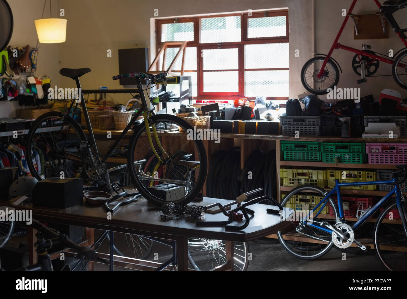 Bicycle and bicycle parts on a table Stock Photo