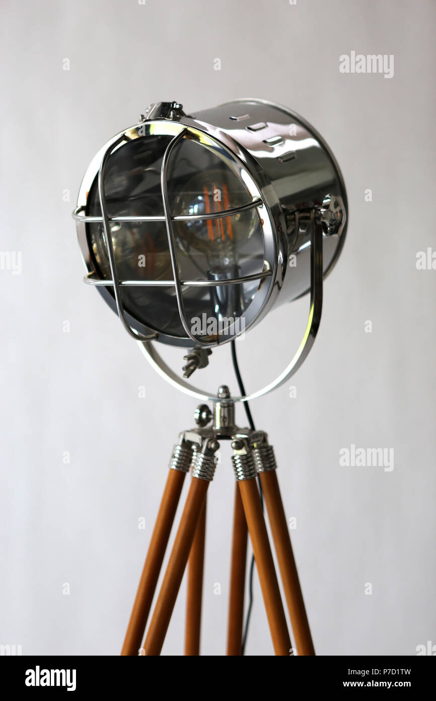 a studio lamp in retro style with wooden tripod Stock Photo - Alamy